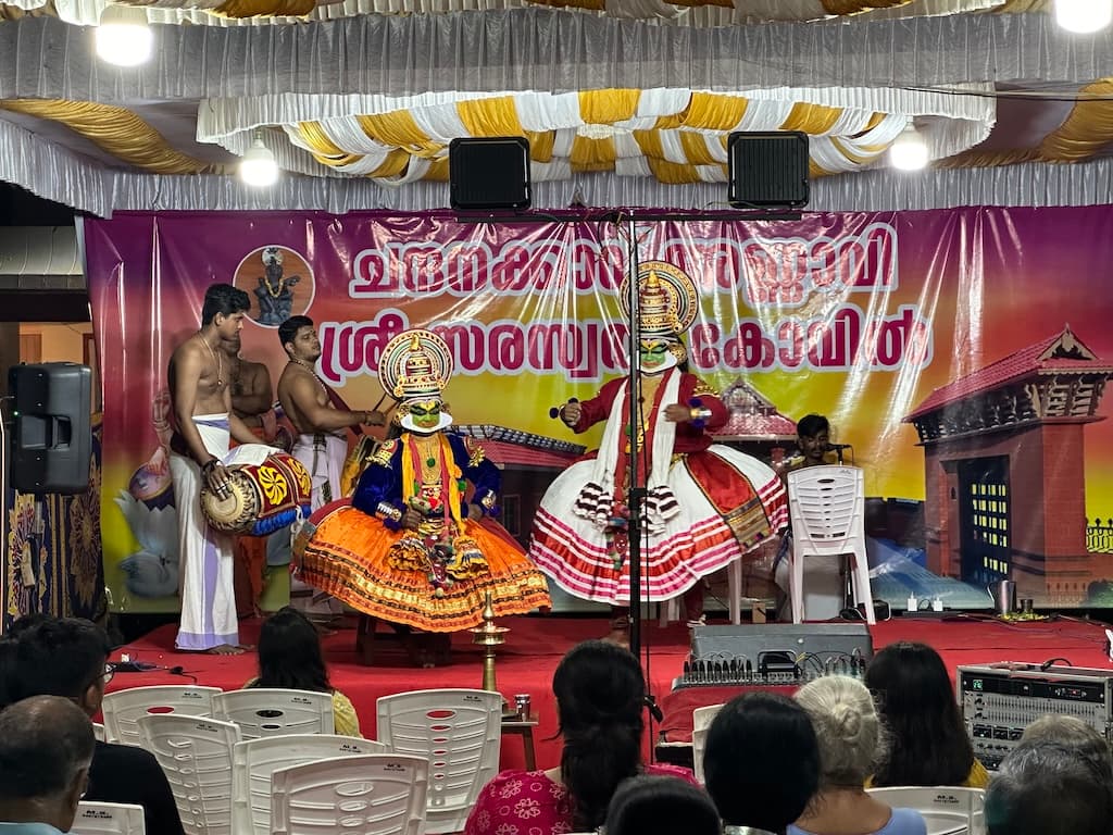 Volunteers preparing offerings during a temple programme.