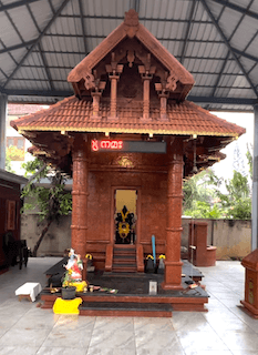 Front elevation of Annavi Saraswathi Temple during daylight.