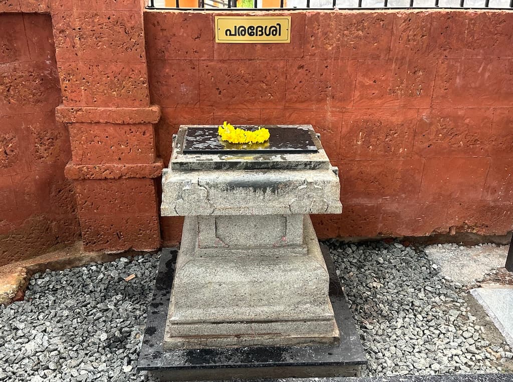 Saraswathi Devi idol surrounded by offerings.