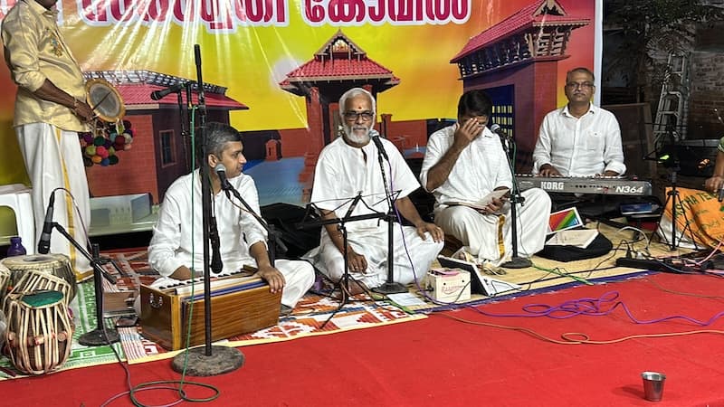 Temple inauguration event with dignitaries lighting the lamp.